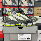 Balenciaga unisex sneakers on box: white mesh upper, neon green accents, black lace-up