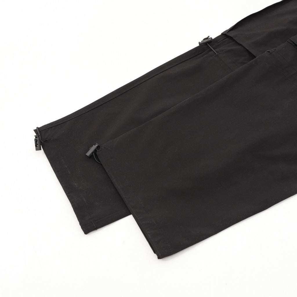Black cargo shorts with side zip detail and cargo pocket