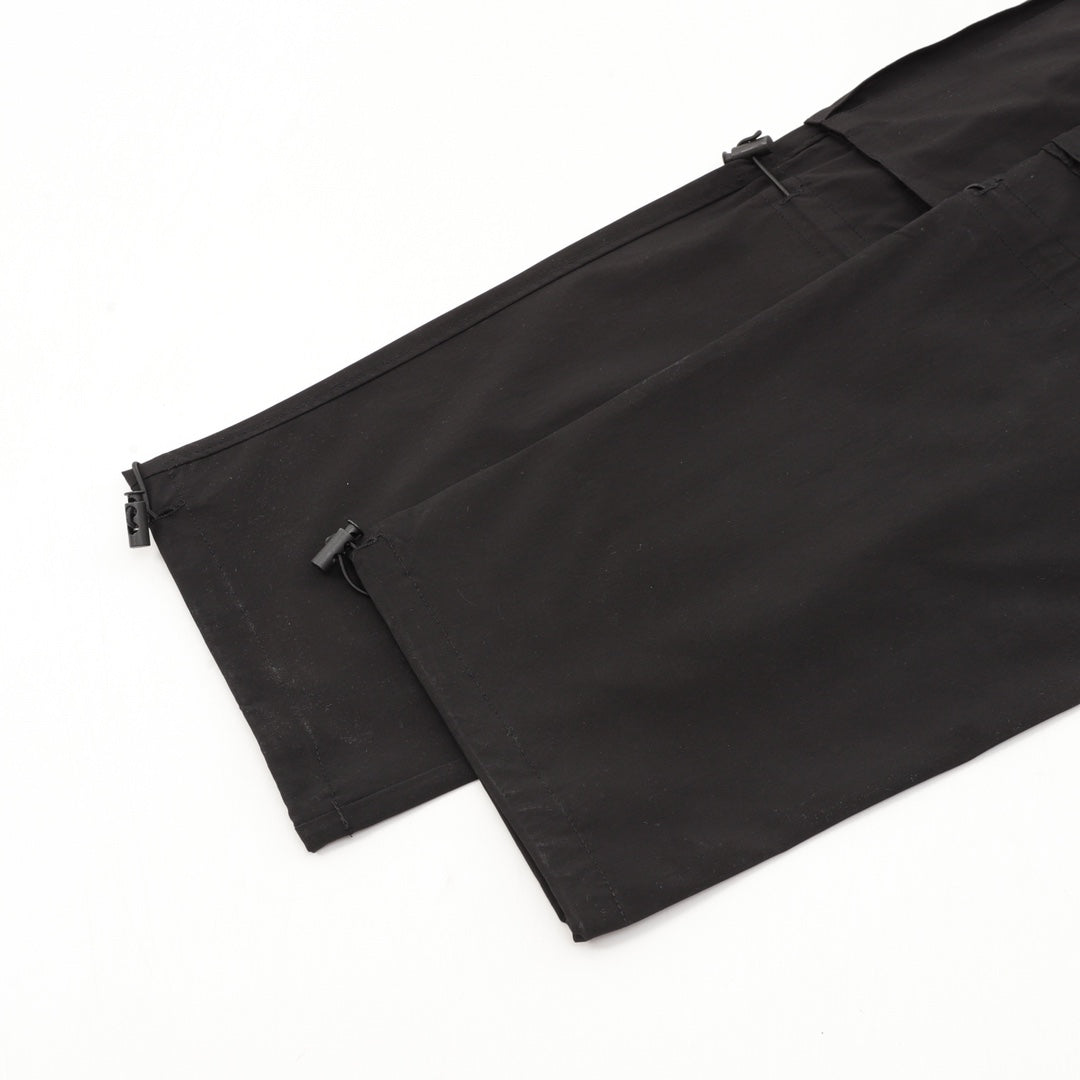 Black cargo shorts with side zip detail and cargo pocket
