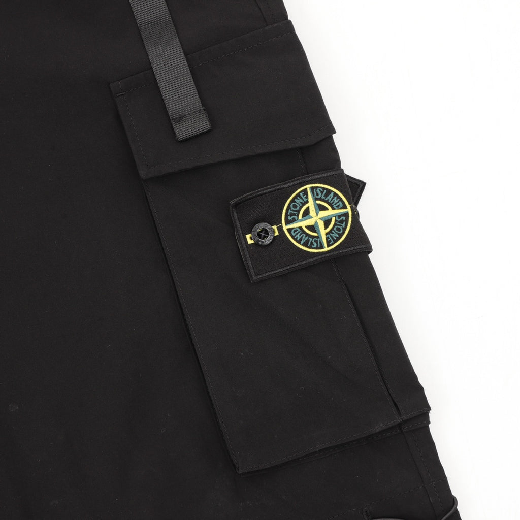 Black cargo shorts with Stone Island patch on flap pocket