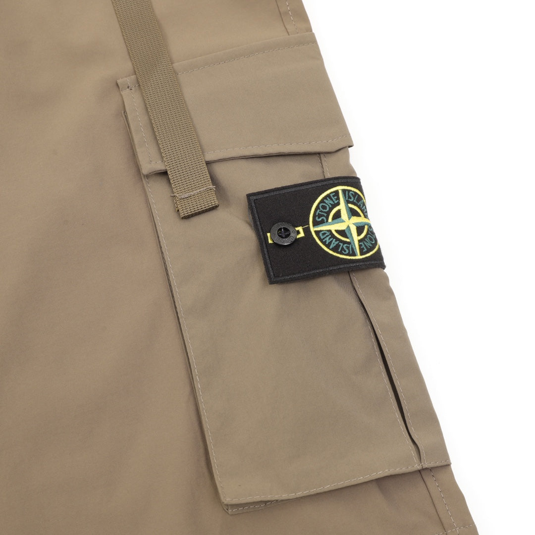 Khaki cargo pocket with Stone Island patch and adjustable strap