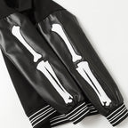 Black jacket sleeves with white bone graphic and striped ribbed cuffs