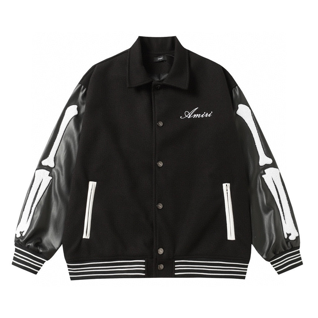 Black varsity jacket with collar, snap buttons, Amiri script logo, ribbed hem and cuffs