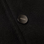 AMIRI logo button on black fabric