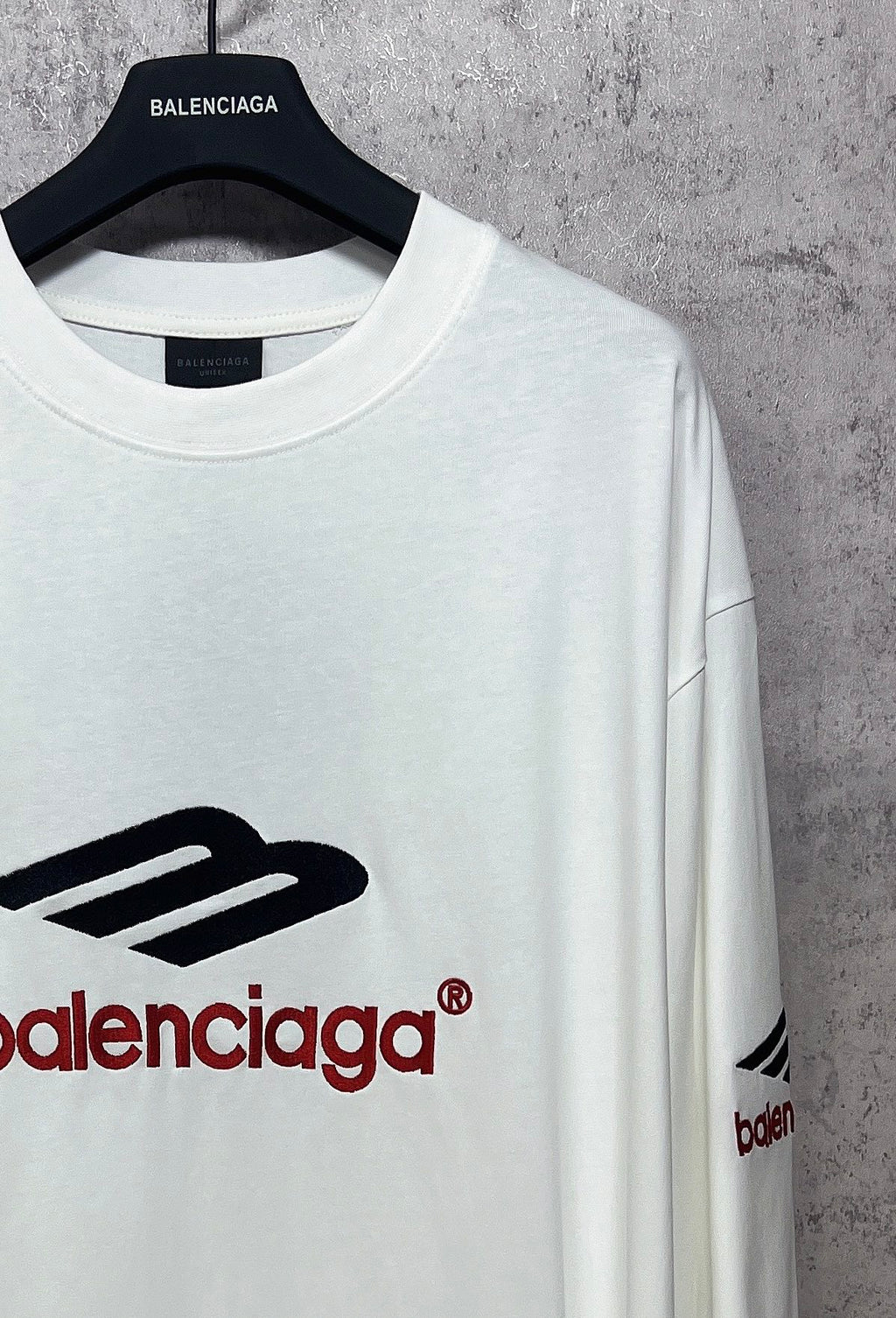 White long-sleeve T-shirt neck and logo detail with black and red Balenciaga print
