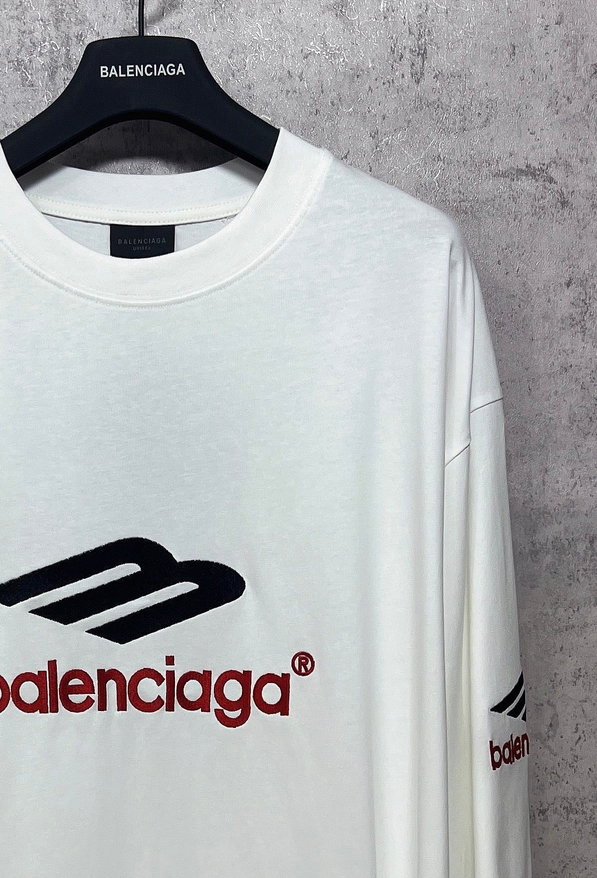 White long-sleeve T-shirt neck and logo detail with black and red Balenciaga print