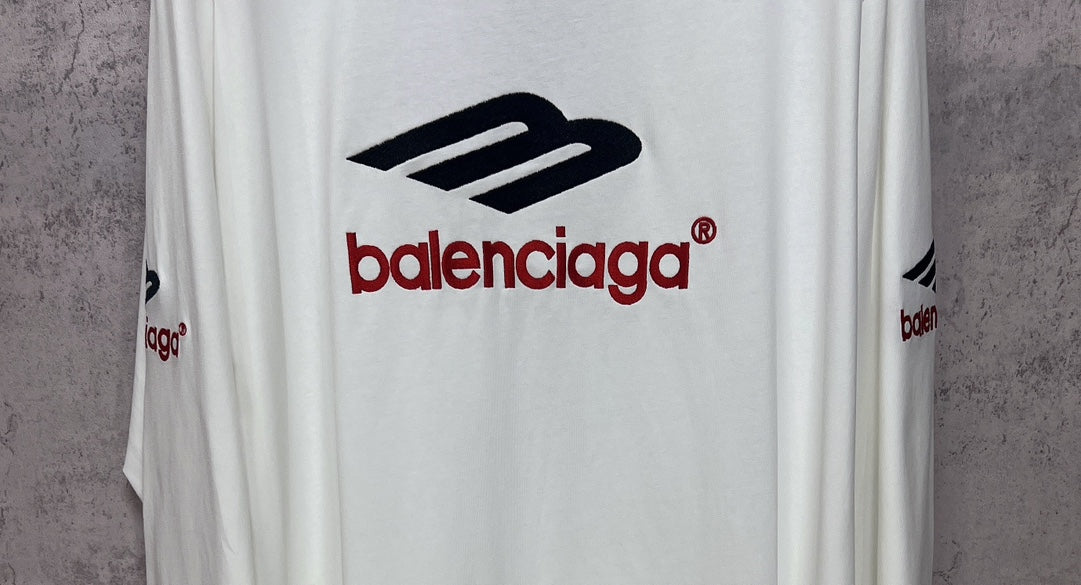 White long-sleeve T-shirt with large black and red Balenciaga logo print