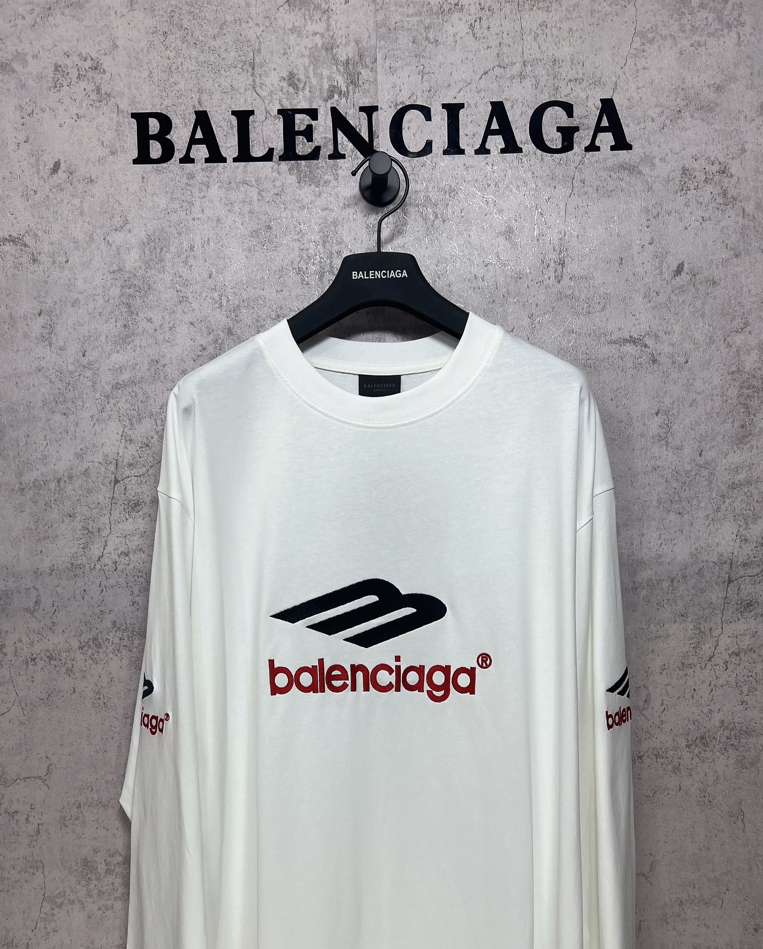 White long-sleeve T-shirt, crew neck, black and red Balenciaga logo on front