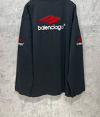 Balenciaga long-sleeve T-shirt, dark navy, back view with red logo above the wordmark