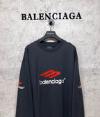 Balenciaga long-sleeve T-shirt, dark navy, close front view with red logo and white brand text
