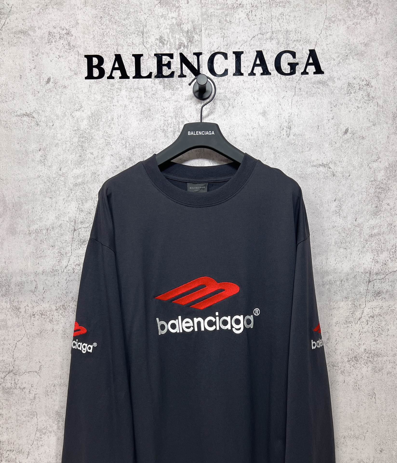 Balenciaga long-sleeve T-shirt, dark navy, close front view with red logo and white brand text