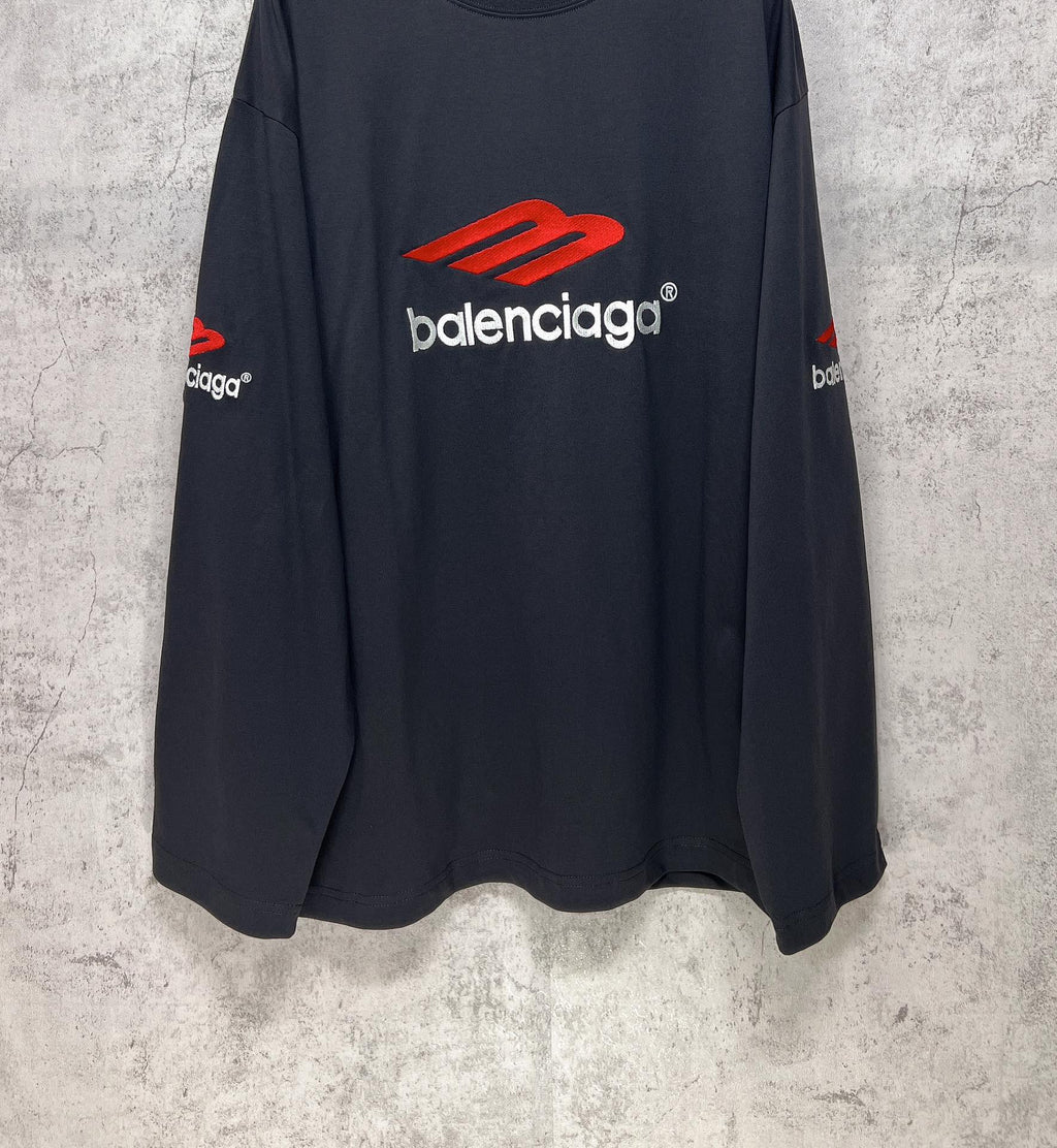 Balenciaga long-sleeve T-shirt, dark navy, side view with red logo on chest and sleeve text