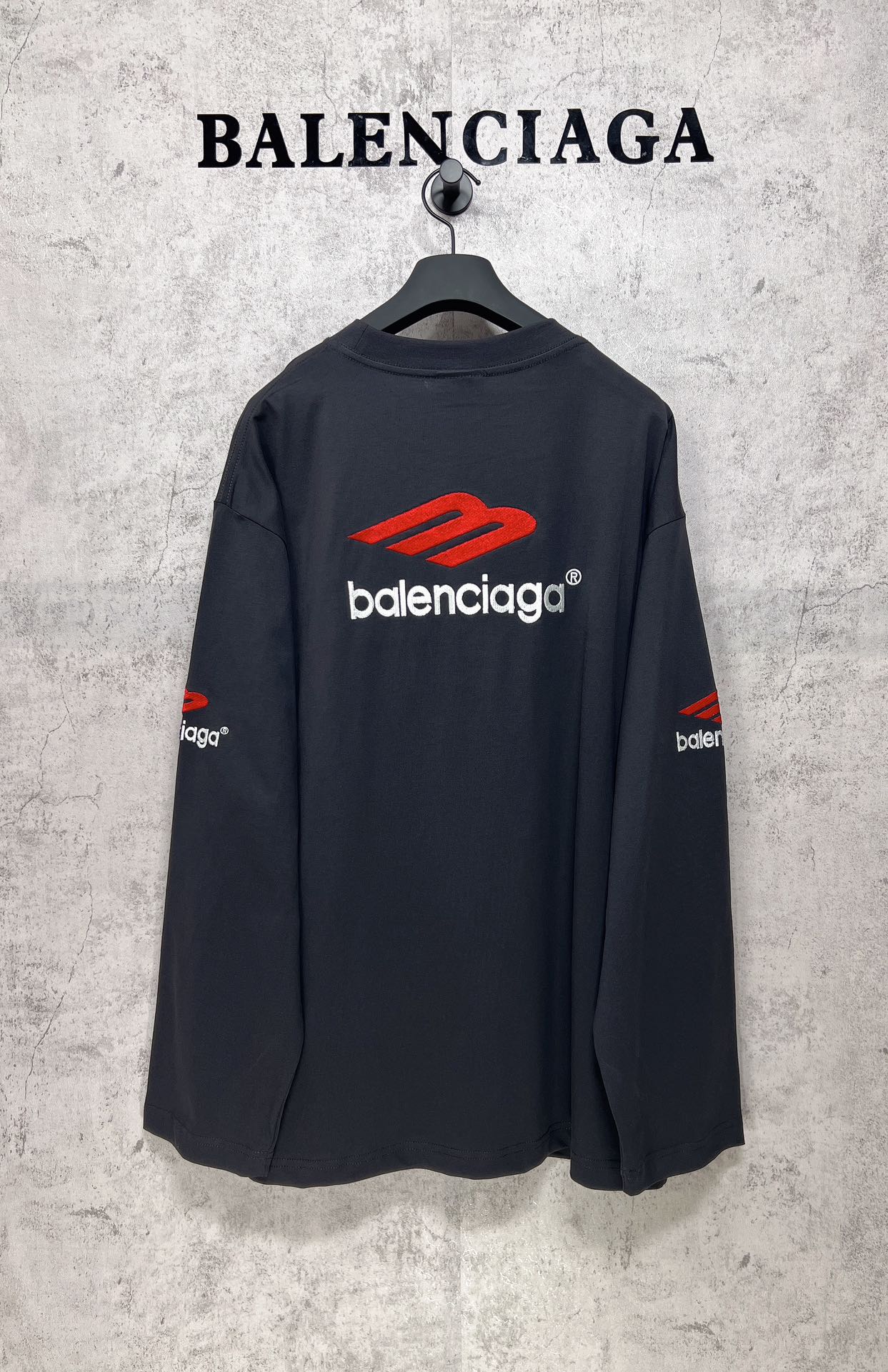 Balenciaga long-sleeve T-shirt, dark navy, back view with red logo and white text on upper back