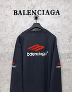 Balenciaga long-sleeve T-shirt, dark navy, back view with red logo and white text centered