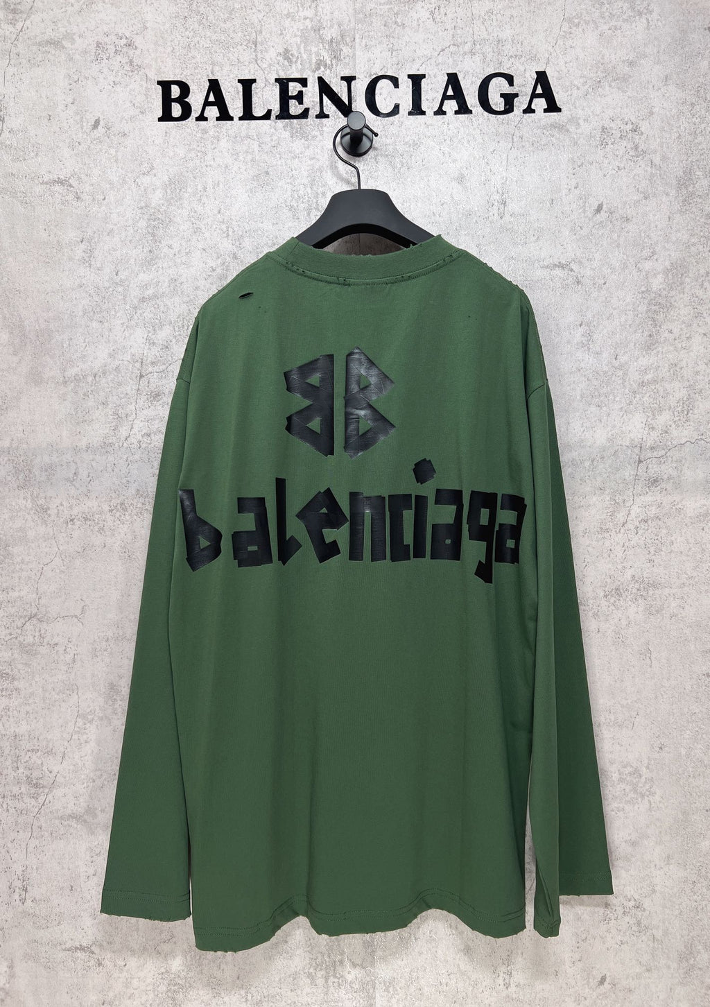 Green long-sleeve T-shirt back view with black Balenciaga logo and emblem print