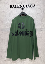 Green long-sleeve T-shirt back view with black Balenciaga logo and emblem print