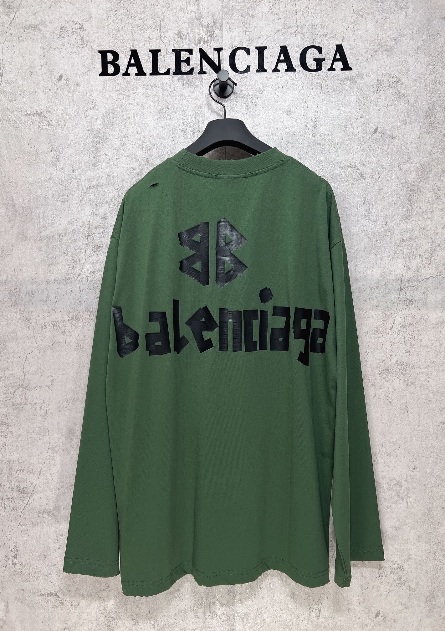 Green long-sleeve T-shirt back view with black Balenciaga logo and emblem print