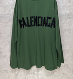 Green long-sleeve T-shirt front view with centered black Balenciaga logo print