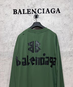 Green long-sleeve T-shirt back view with black Balenciaga logo and emblem print