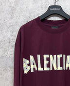 Maroon long-sleeve T-shirt with Balenciaga text graphic across chest