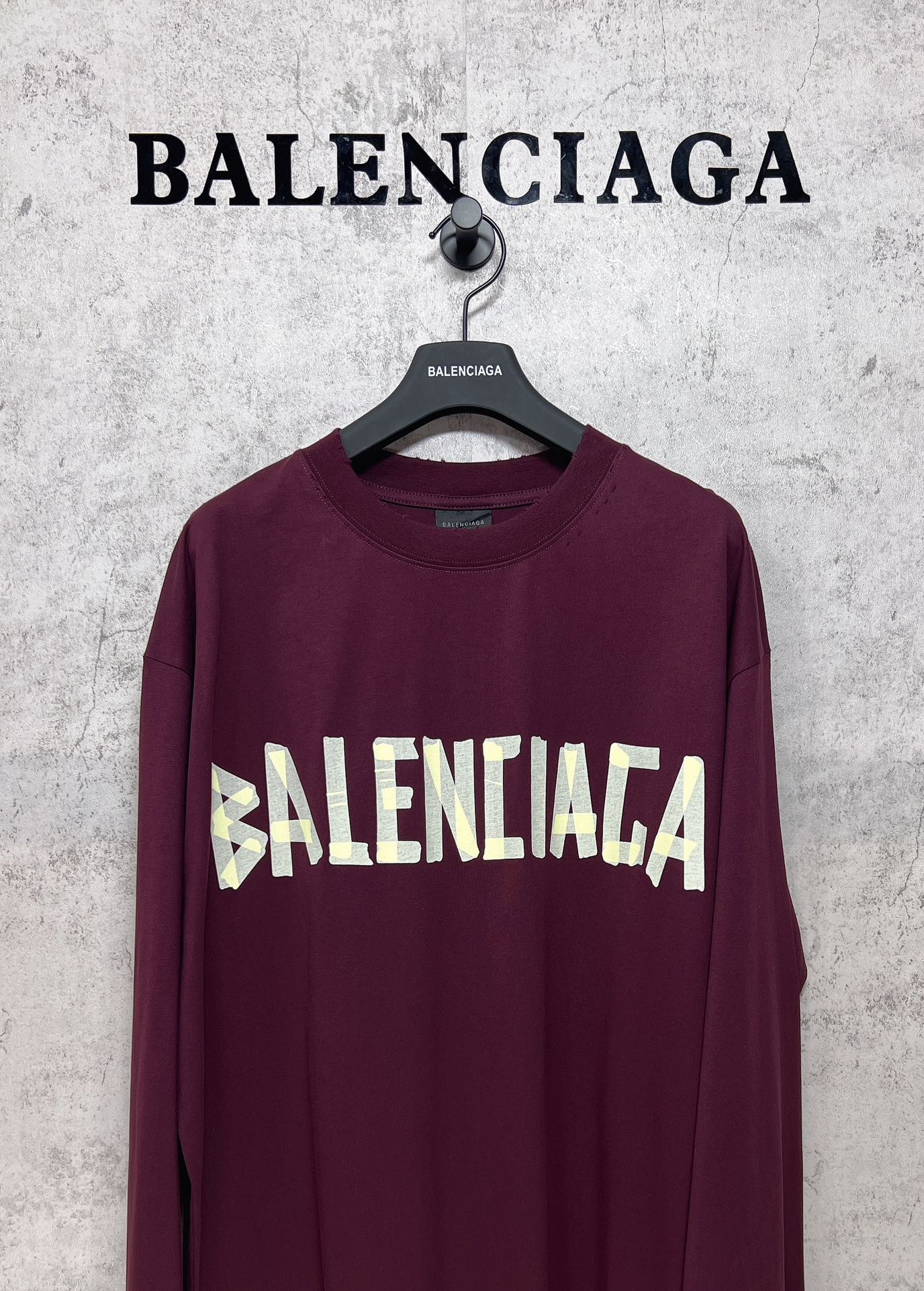 Maroon long-sleeve T-shirt with large Balenciaga front text graphic