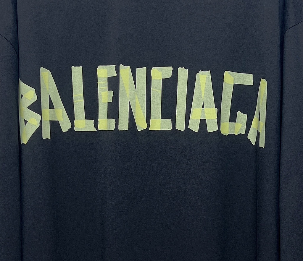 Balenciaga logo graphic on dark long-sleeve T-shirt in neon green