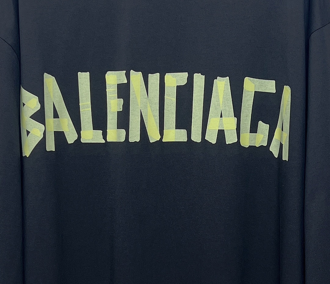 Balenciaga logo graphic on dark long-sleeve T-shirt in neon green