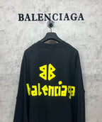 Balenciaga long-sleeve T-shirt on hanger, dark with neon green back logo