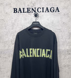 Balenciaga long-sleeve T-shirt with dark body and neon green logo on chest
