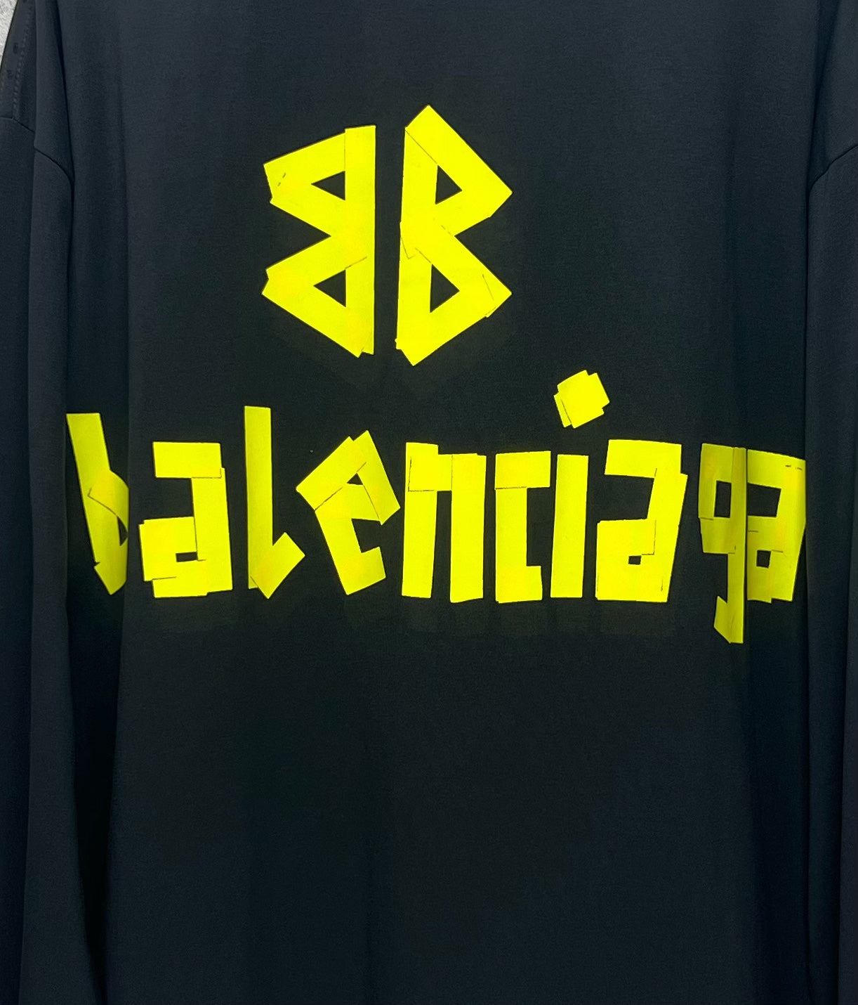 Neon green logo print detail on dark Balenciaga long-sleeve T-shirt back