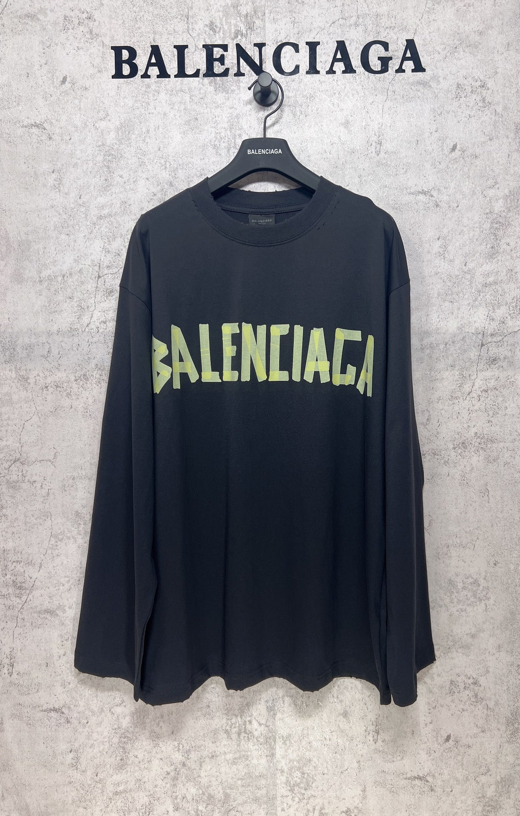 Balenciaga long-sleeve T-shirt, dark with neon green logo print across chest