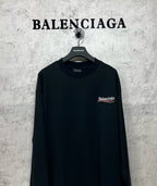 Dark long-sleeve T-shirt with chest logo patch