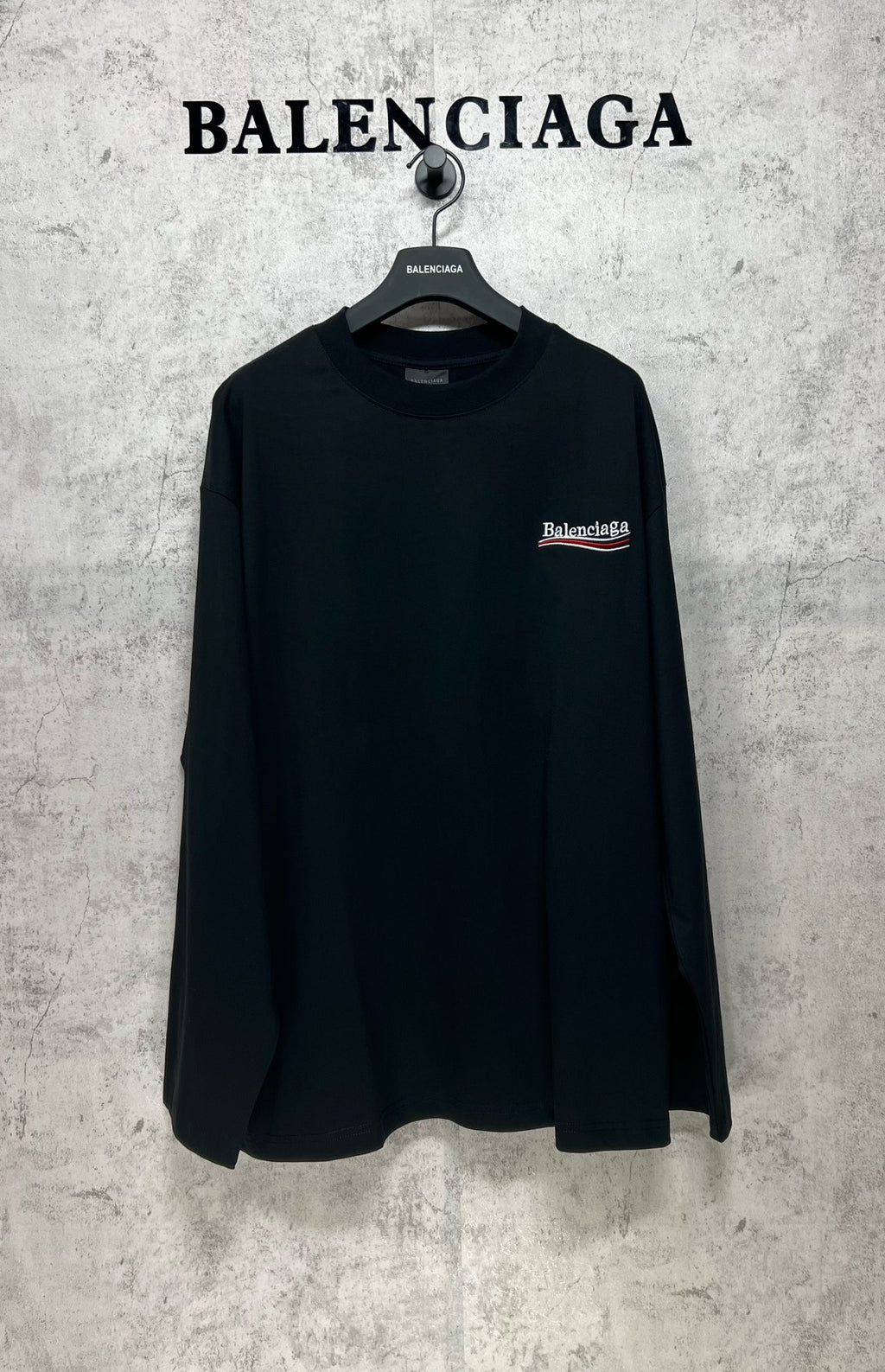 Dark long-sleeve T-shirt with small chest logo