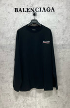 Dark long-sleeve T-shirt with small chest logo