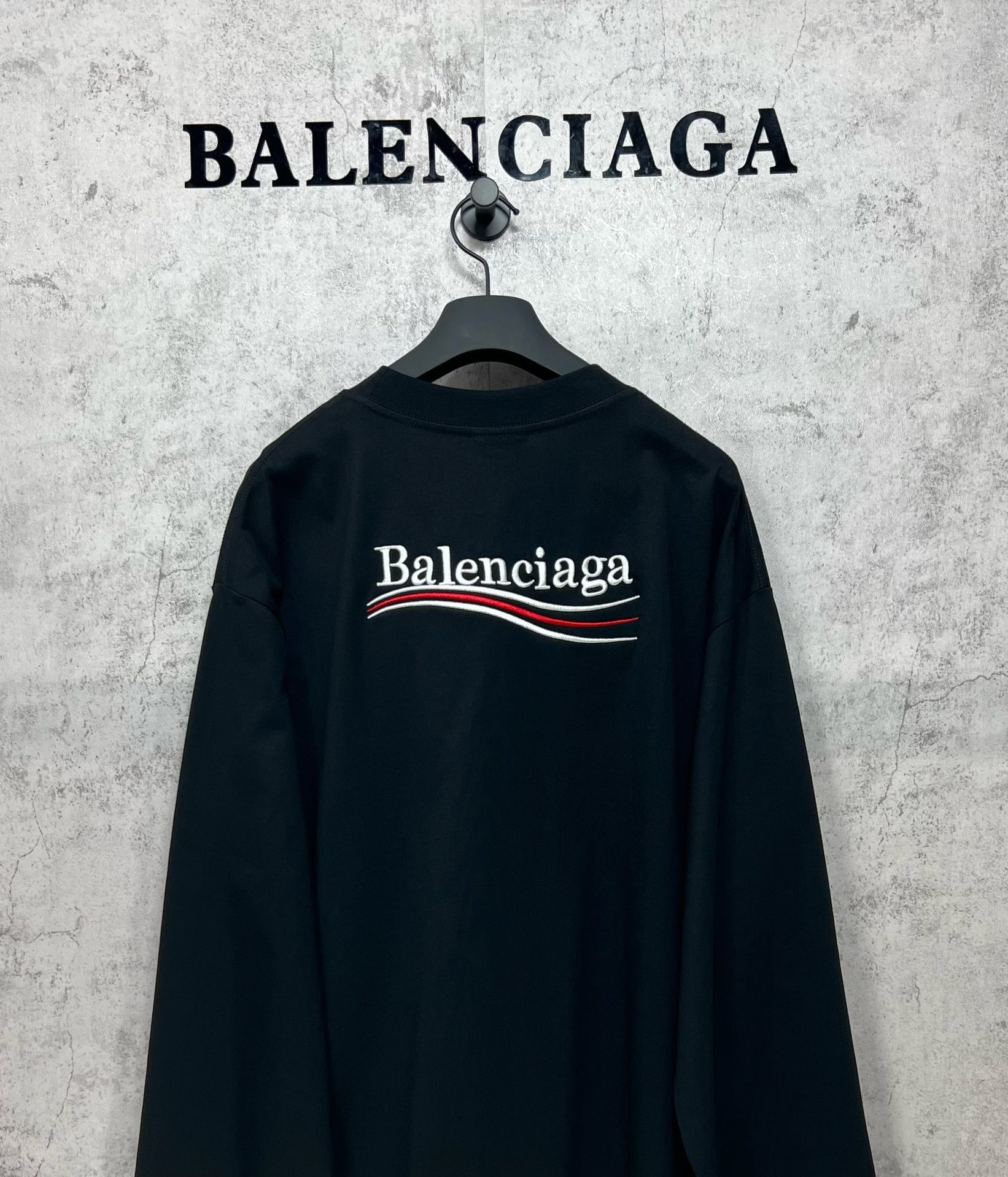 Dark long-sleeve T-shirt with large Balenciaga logo on back