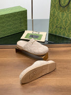 Gucci logo slide sandals, outsole view with light beige tread and interlocking G emblem