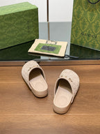 Gucci logo slide sandals, light beige open-back mules with cream footbed and straps