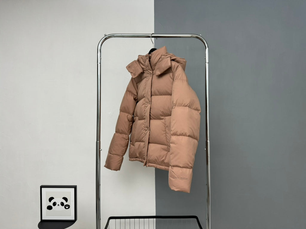 Tan puffer jacket with attached hood and full-length sleeves