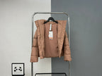 Tan hooded puffer jacket with front buttons and hang tag
