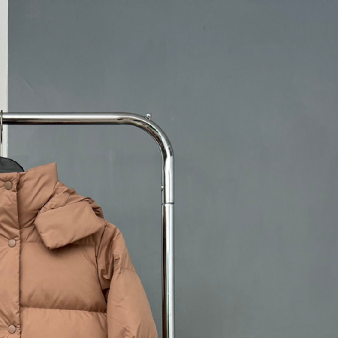 Tan puffer jacket sleeve and shoulder with quilted stitch panels