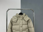Beige hooded puffer jacket front view with attached hood and central zipper