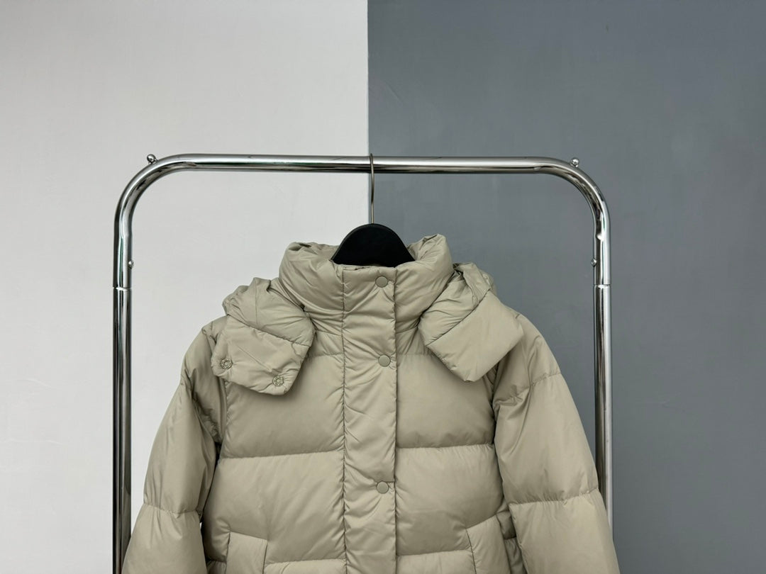 Beige hooded puffer jacket front view with attached hood and central zipper