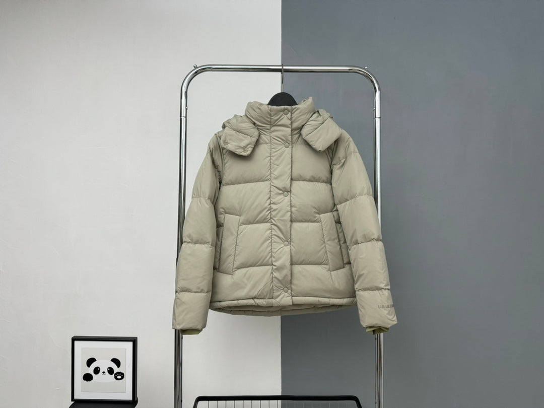 Beige hooded puffer jacket with front zipper and snap pockets