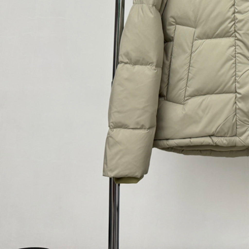 Beige hooded puffer jacket sleeve and cuff detail