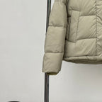 Beige hooded puffer jacket sleeve and cuff detail