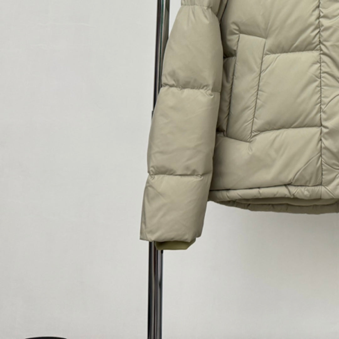 Beige hooded puffer jacket sleeve and cuff detail