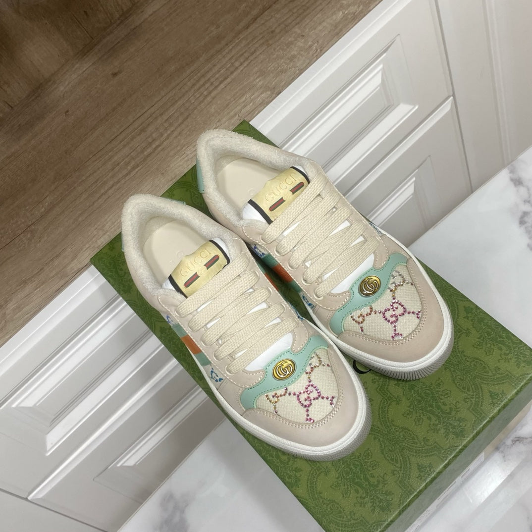 Gucci unisex sneakers, cream with gold emblem and multicolor stripe at side