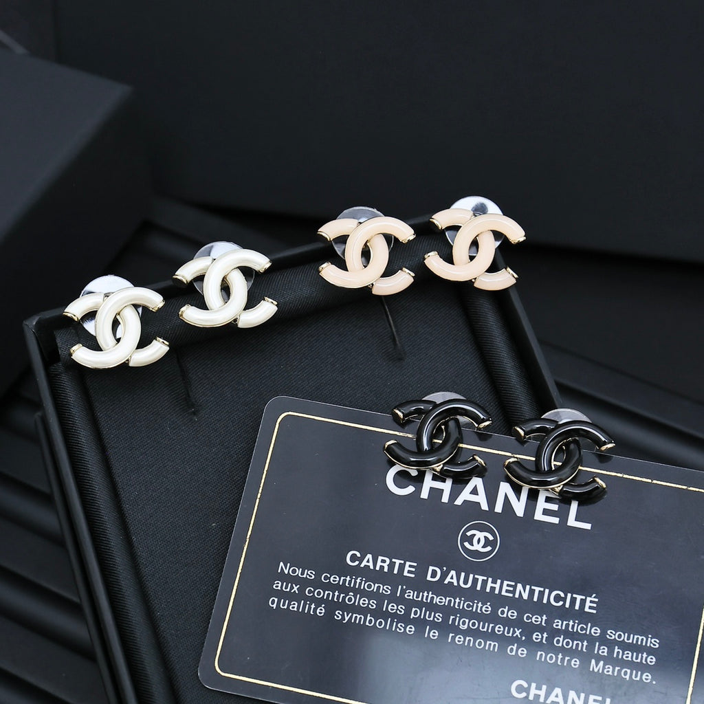 Chanel CC link stud earrings with white enamel and gold-tone hardware