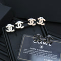 Chanel CC link stud earrings with white enamel and gold-tone hardware