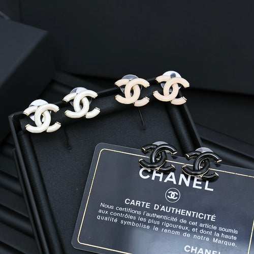 Chanel CC link stud earrings with white enamel and gold-tone hardware